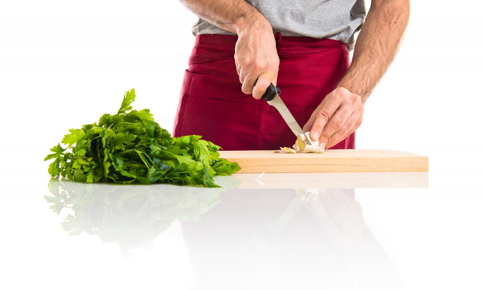 Chef practicing knife cuts on board