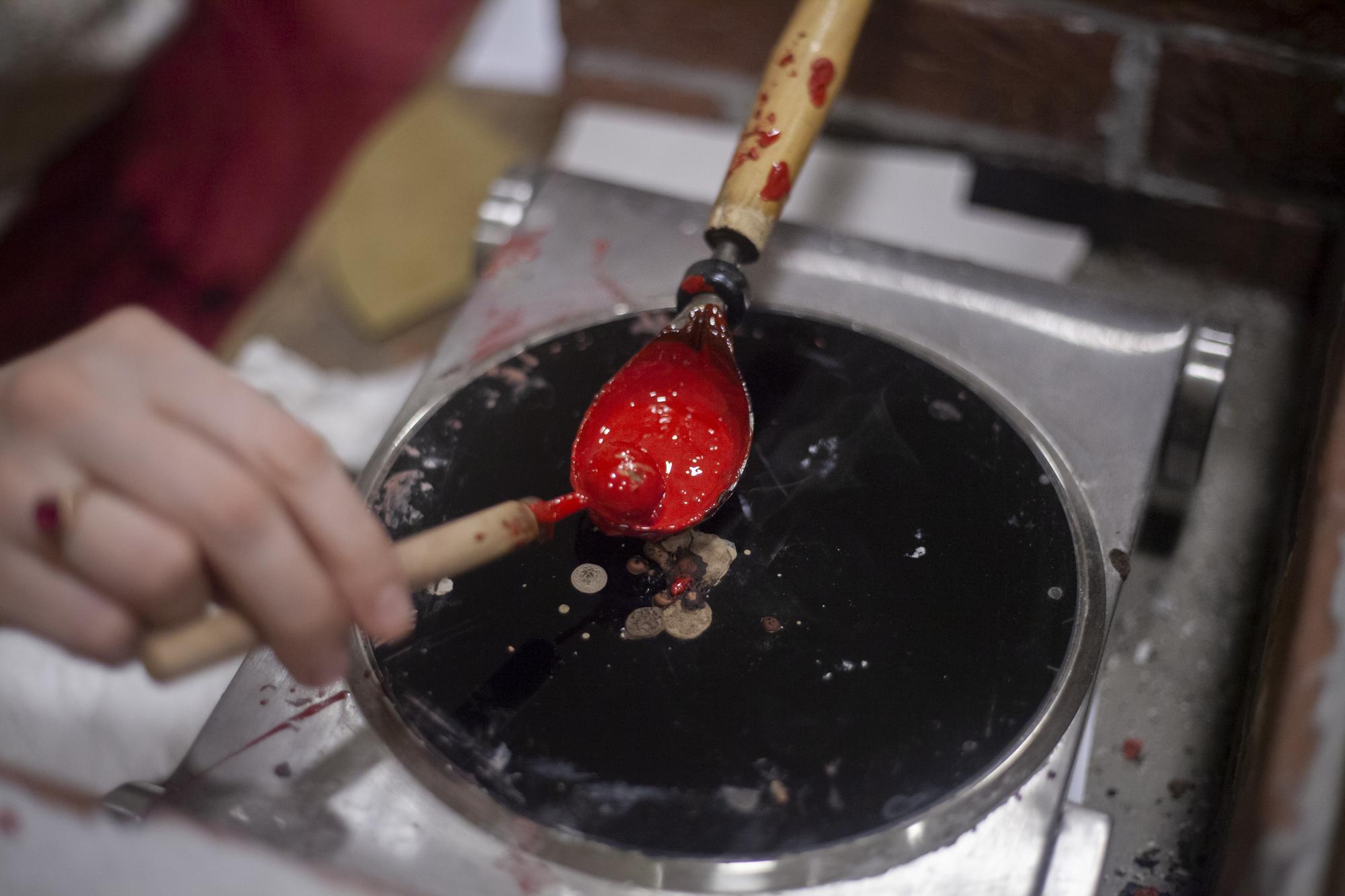 Sauce reduction on stove with ladle